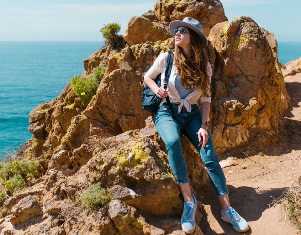 Woman sitting on rock